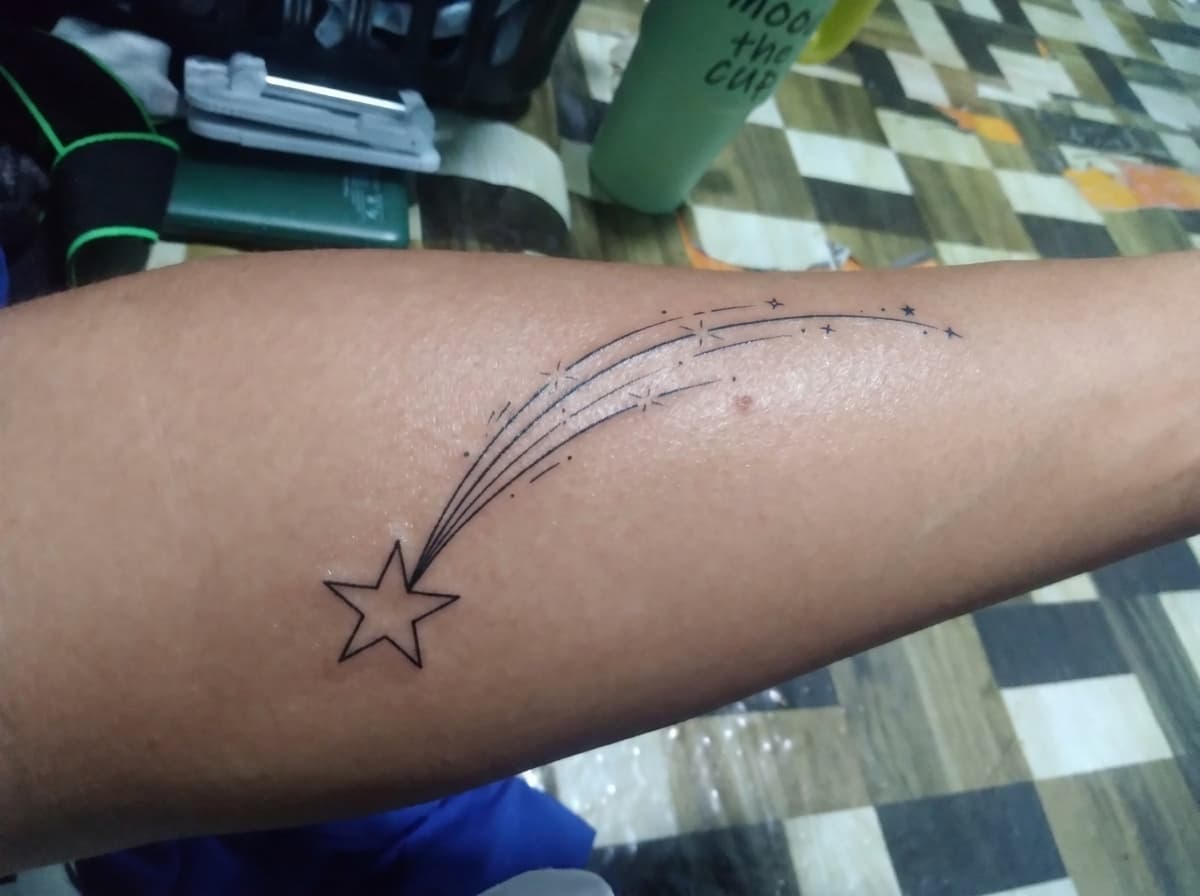 shooting star with a trailing sparkle