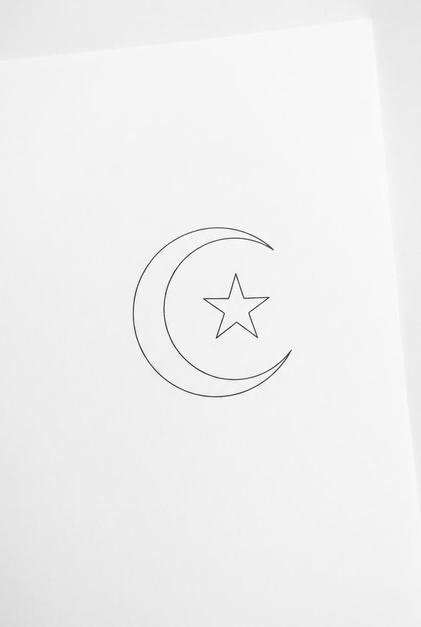crescent moon cradling a single star — alternate version